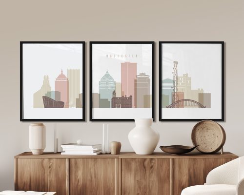 Three framed art prints depicting the skyline of Rochester, New York, in pastel colors.