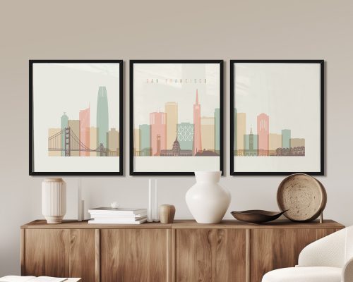 Three framed art prints depicting a stylized cityscape of San Francisco with notable buildings.