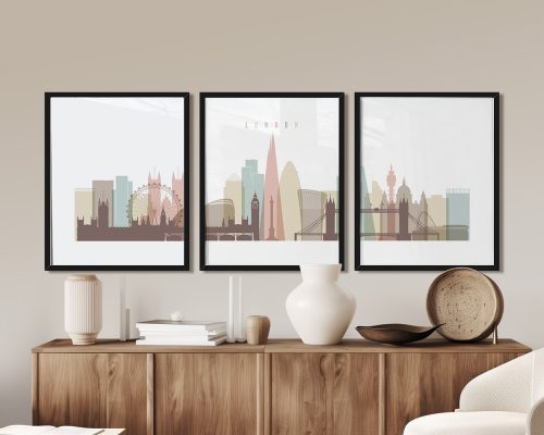 Three framed art prints depicting a stylized London cityscape with notable landmarks.
