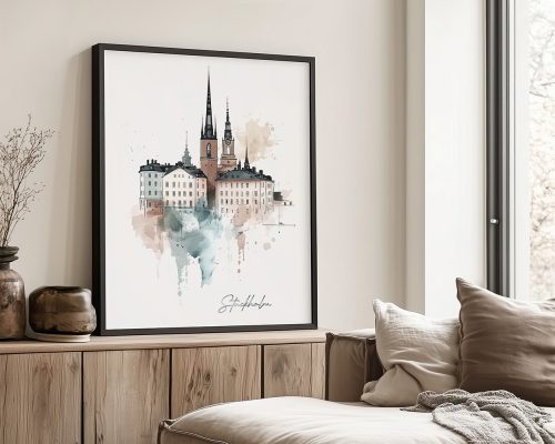 Framed artwork depicting a watercolor illustration of Stockholm's skyline with prominent spires and buildings.