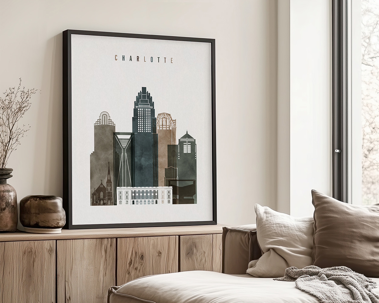 Framed art print of the Charlotte skyline featuring various buildings in muted colors.