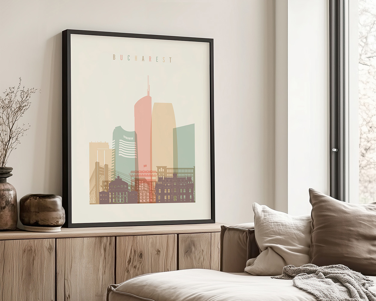 Framed artwork depicting a stylized cityscape of Bucharest with pastel colors.