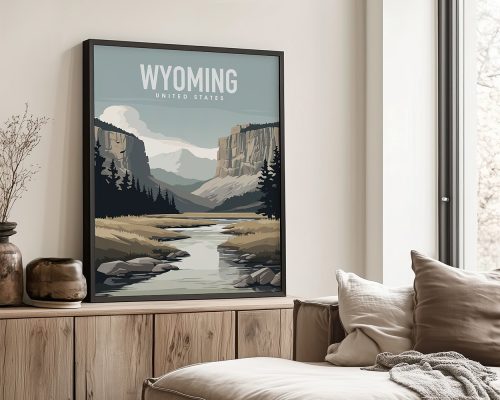 Framed artwork depicting a Wyoming landscape with mountains and a river.