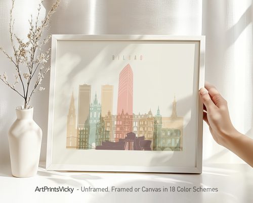 Framed artwork featuring a stylized cityscape of Bilbao with prominent buildings in soft colors.