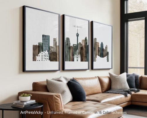 Three framed art prints depicting a cityscape of Calgary with various buildings and structures.