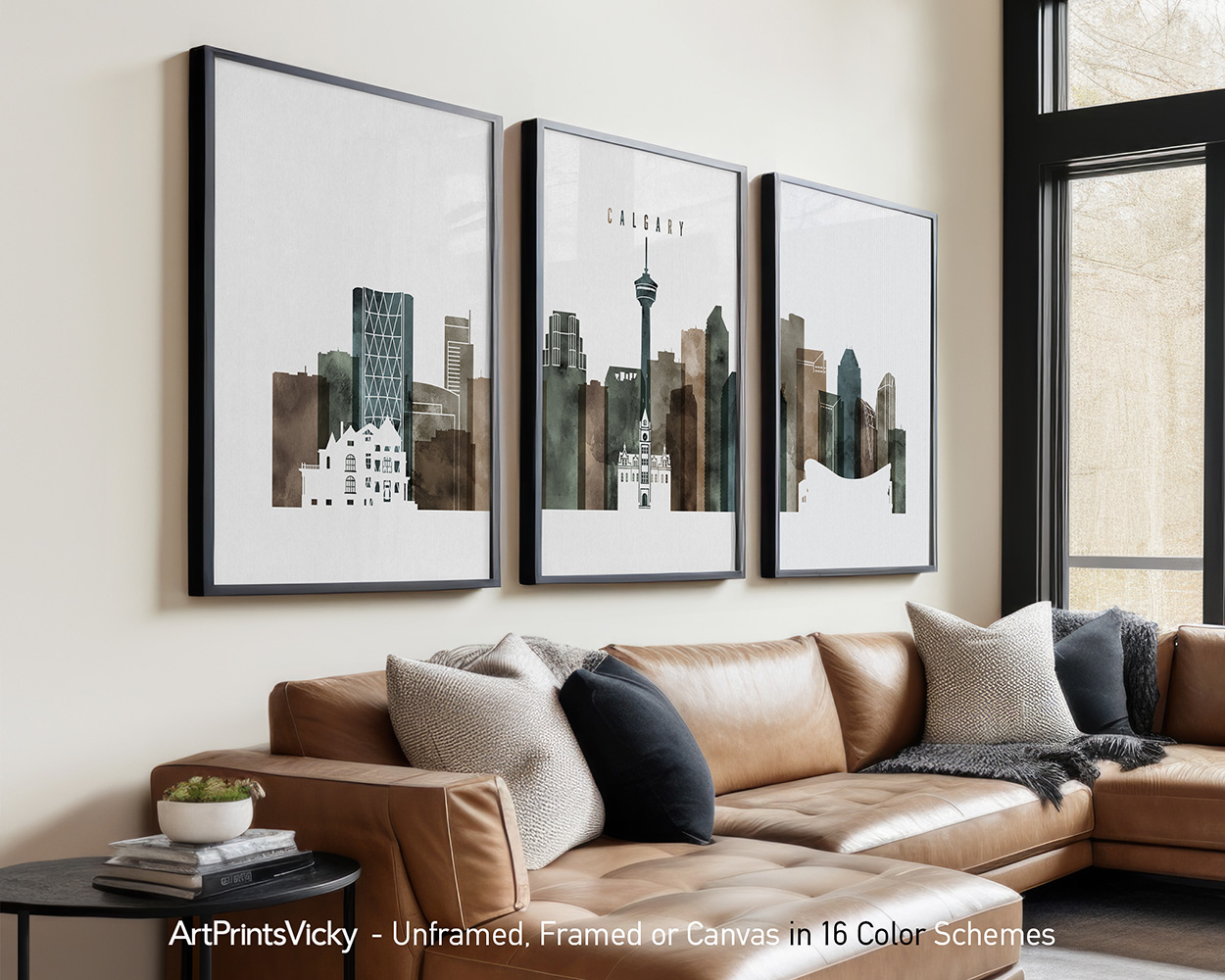 Three framed art prints depicting a cityscape of Calgary with various buildings and structures.