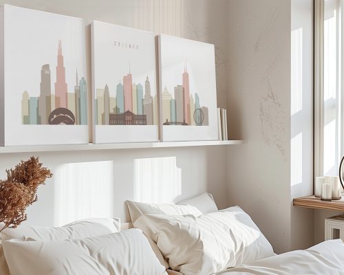 Three art prints of the Chicago skyline displayed above a bed in a neutral room.