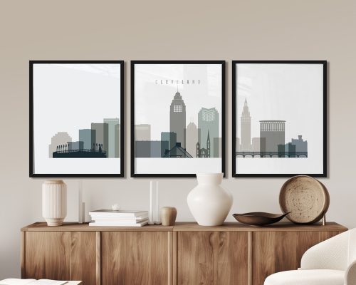 Three framed art prints depicting the skyline of Cleveland, Ohio, in a minimalist style.