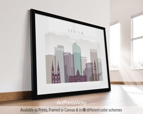 Framed artwork depicting a stylized cityscape of Denver with notable buildings and mountains in the background.