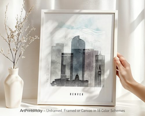 Framed artwork depicting a stylized skyline of Denver with abstract elements and soft colors.