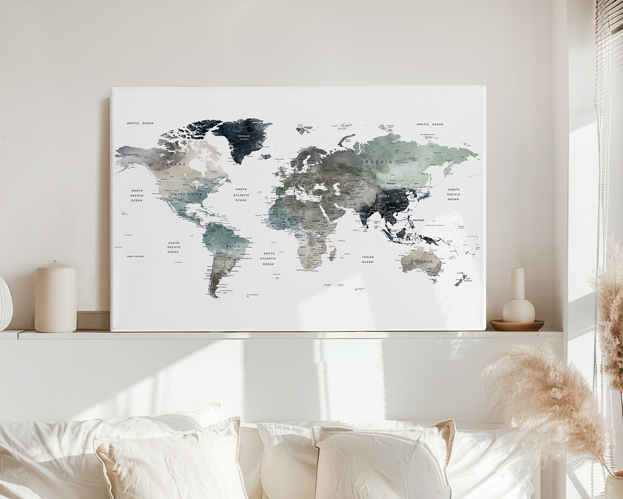 World map artwork in earth tones displayed on a wall above a sofa.