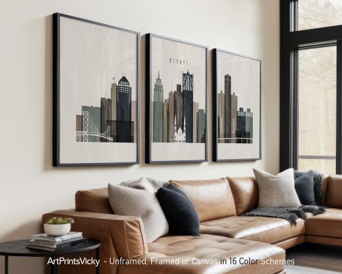 Three framed art prints depicting the skyline of Detroit with various buildings and structures.