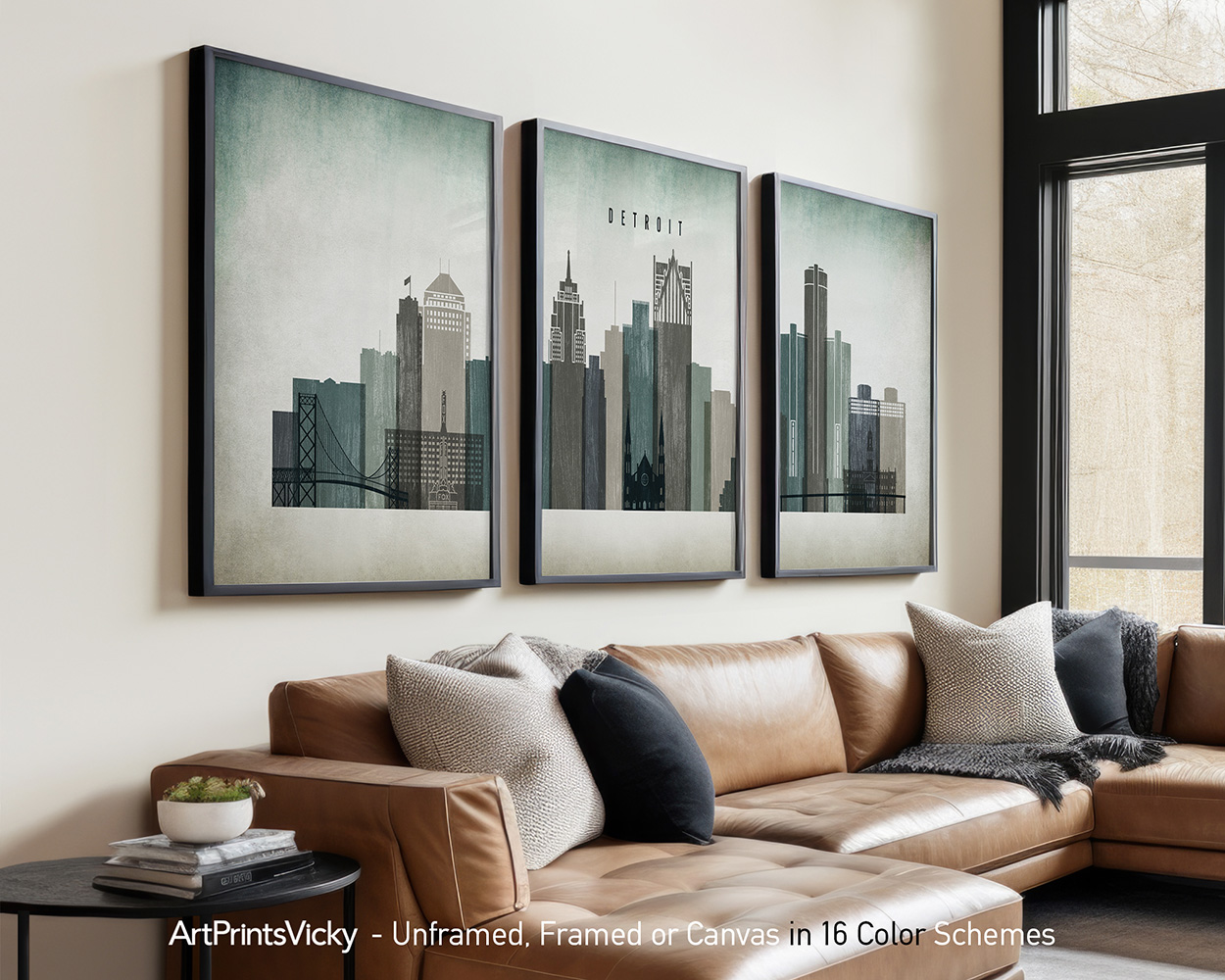 Three framed art prints depicting a cityscape of Detroit with buildings and skyline.