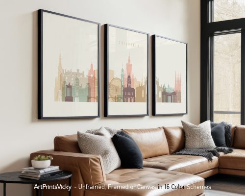 Three framed art prints of Edinburgh's cityscape displayed on a wall.