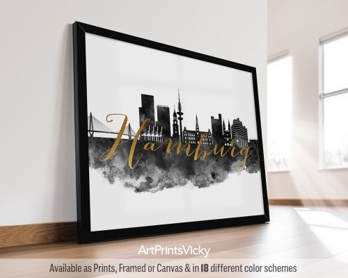 Framed artwork featuring the skyline of Hamburg with the word 'Hamburg' in gold lettering.