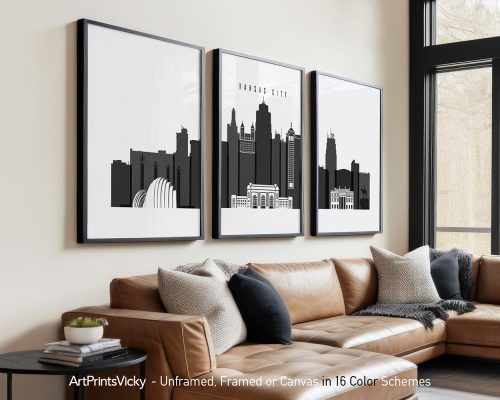 Three framed black and white prints of Kansas City skyline displayed on a wall.