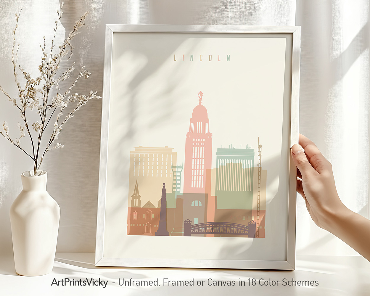 Art print of the Lincoln city skyline featuring various building silhouettes in pastel colors.