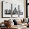Three framed art prints of a London cityscape featuring iconic landmarks in a minimalist style.