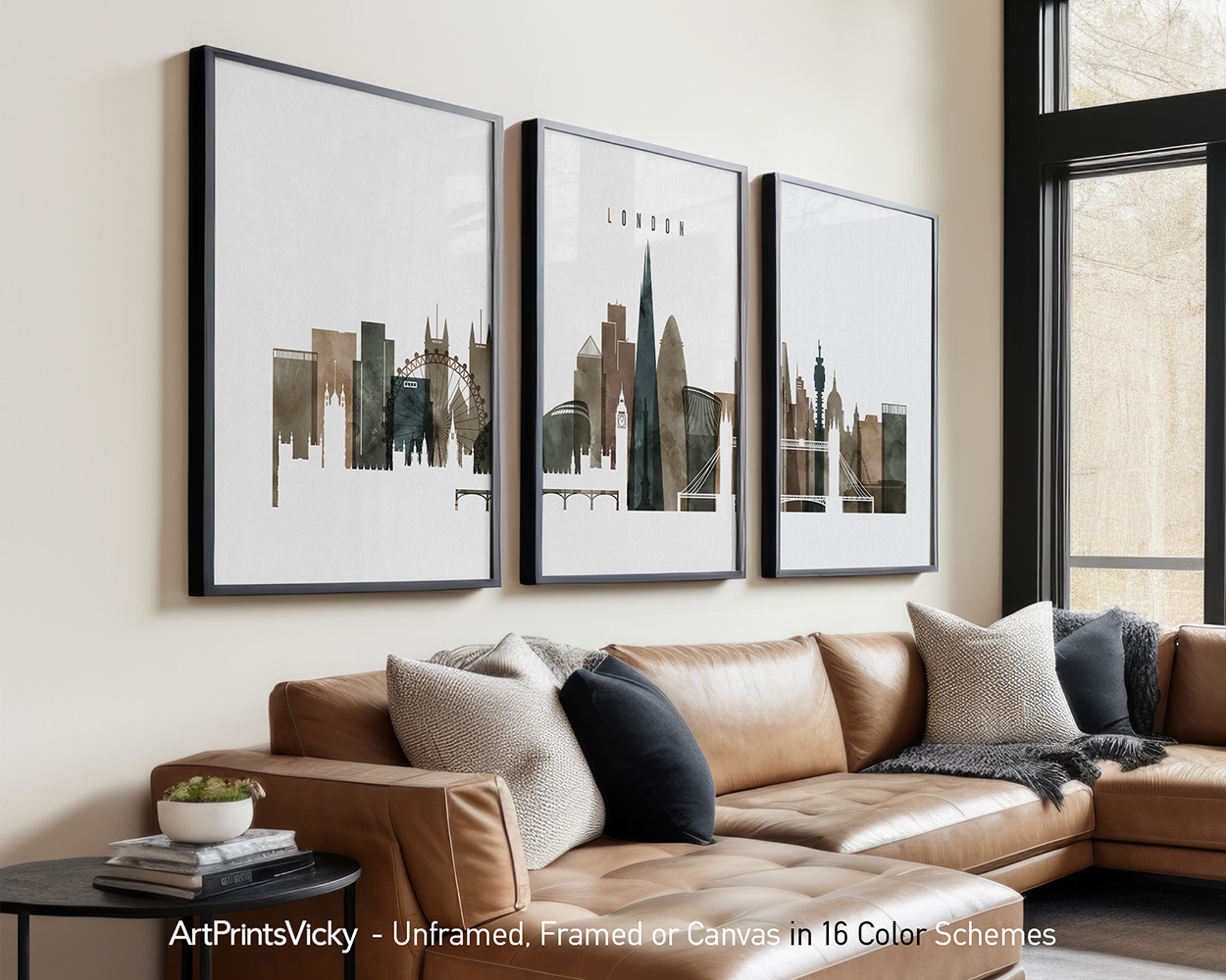 Three framed prints of a London cityscape displayed on a wall above a sofa.