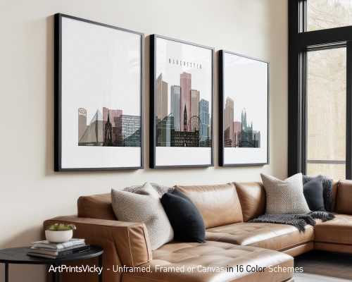 Three framed art prints depicting a cityscape of Manchester with modern buildings and landmarks.