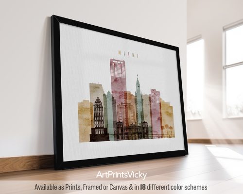 Framed artwork depicting a stylized cityscape of Miami with various buildings and colors.