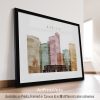 Framed artwork featuring a cityscape of Naples with various buildings in soft colors.