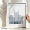 Framed art print featuring a stylized cityscape of Nashville with notable buildings.