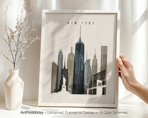 Framed artwork depicting the New York City skyline with notable buildings and the Statue of Liberty.