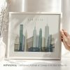 Framed artwork depicting the skyline of New York City with various iconic buildings.