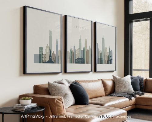 Three framed art prints depicting the New York City skyline in a minimalist style.