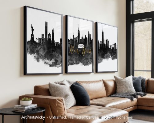 Three framed art prints of the New York City skyline in black and white with gold text.