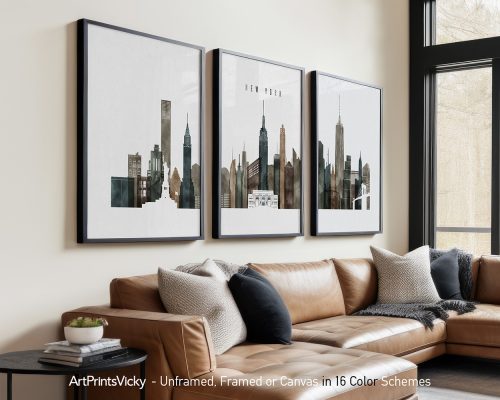 Three framed art prints depicting the New York City skyline with various buildings.