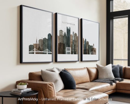 Three framed prints of Pittsburgh's skyline featuring buildings and a bridge.