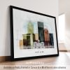 Framed artwork depicting a cityscape of Portland with various buildings and a bridge.