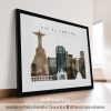 Framed artwork depicting a cityscape of Rio de Janeiro with notable landmarks.
