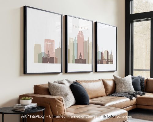 Three framed art prints depicting a cityscape of Sacramento with various buildings and colors.