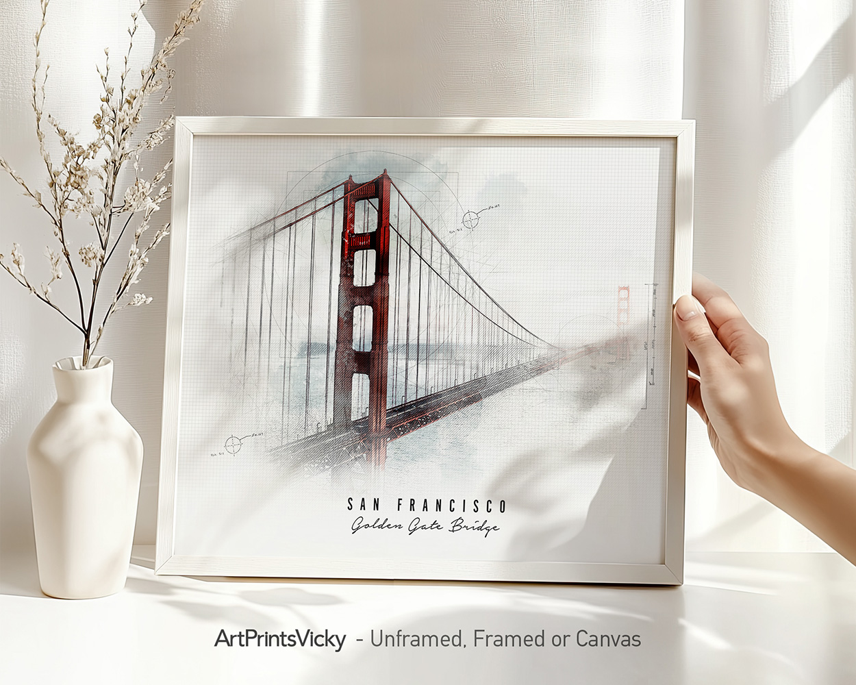 Framed artwork depicting the Golden Gate Bridge in San Francisco with a soft background.