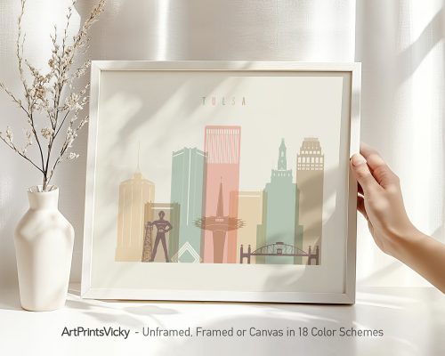 Framed artwork depicting a stylized cityscape of Tulsa with various buildings and structures.