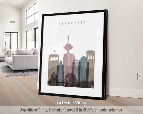 Framed artwork depicting a cityscape of Vancouver with prominent buildings and skyline features.