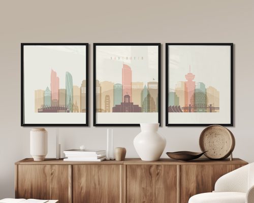 Three framed art prints depicting a stylized cityscape of Vancouver with pastel colors.