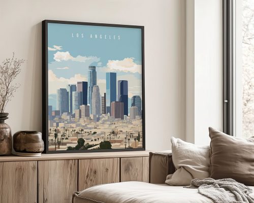 Framed artwork depicting a cityscape of Los Angeles with buildings and clouds in the background.