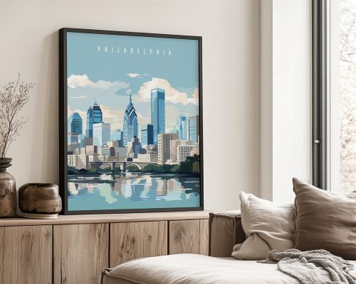 Framed artwork depicting the skyline of Philadelphia with a river reflection.