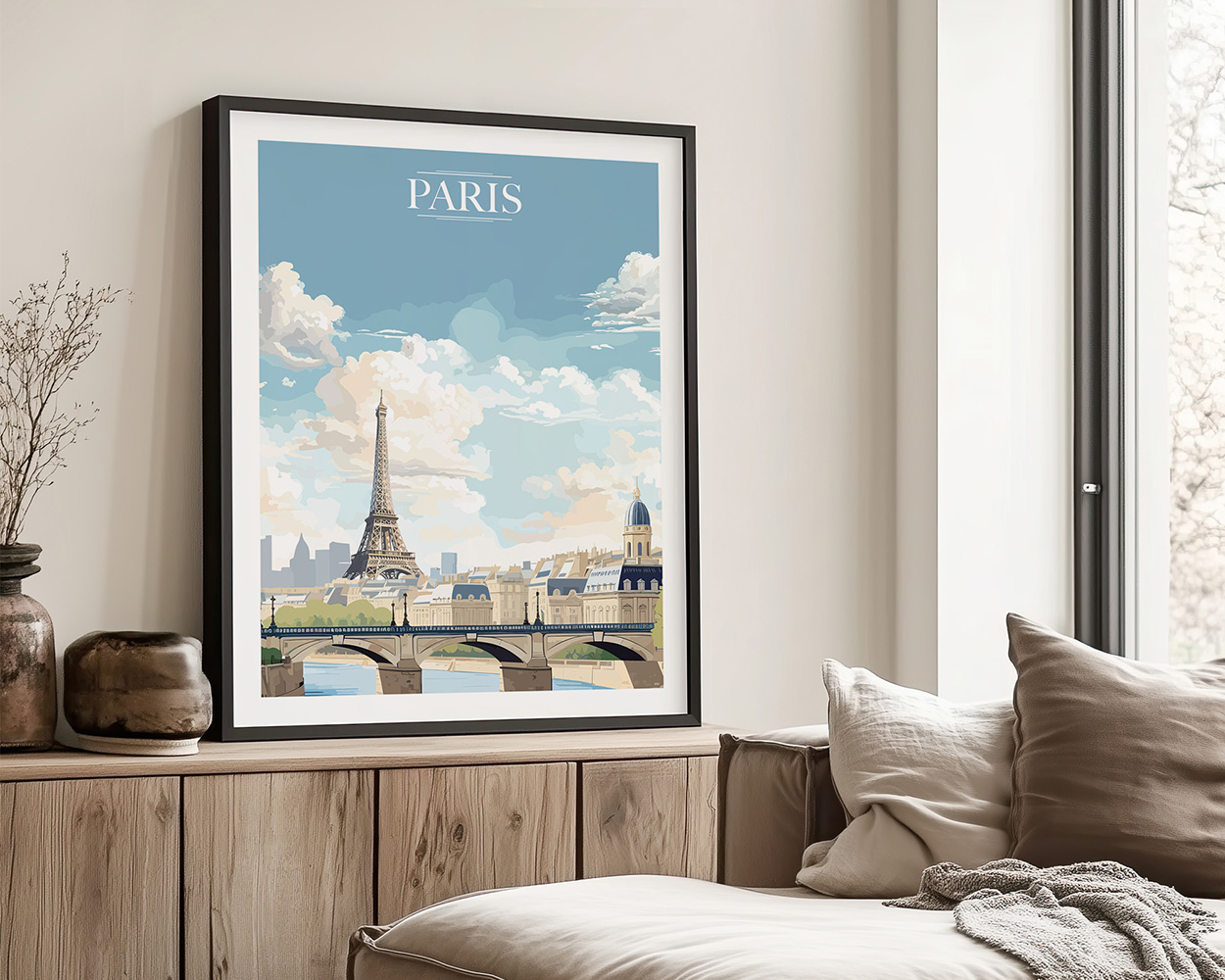 Framed artwork depicting the Eiffel Tower and a bridge in Paris with a blue sky and clouds.