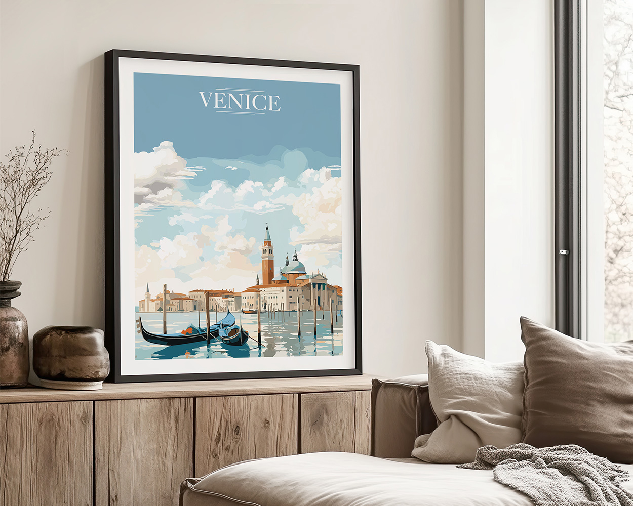 Framed artwork depicting a scenic view of Venice with boats and buildings under a blue sky.